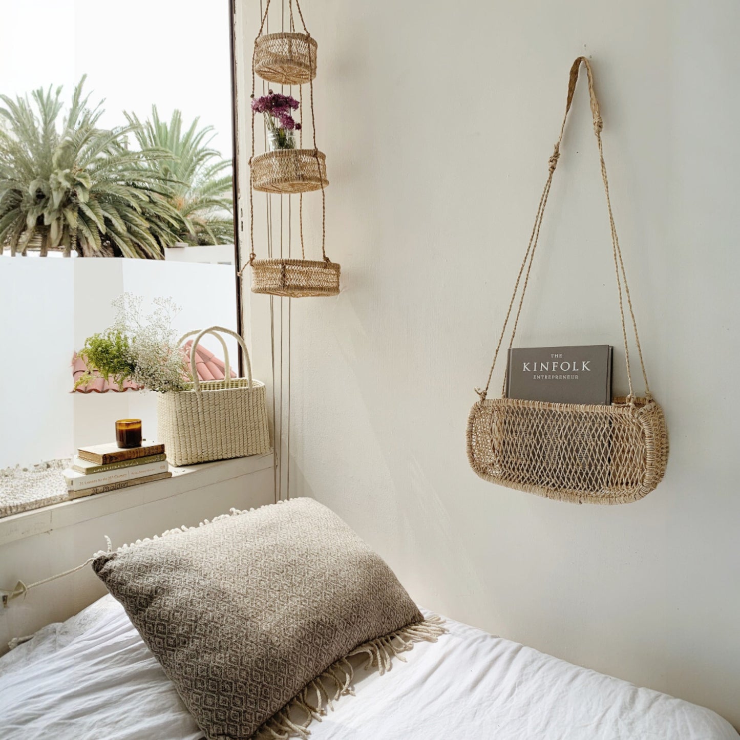 Three-tier jonote hanging basket displayed in a bedroom next to a window.