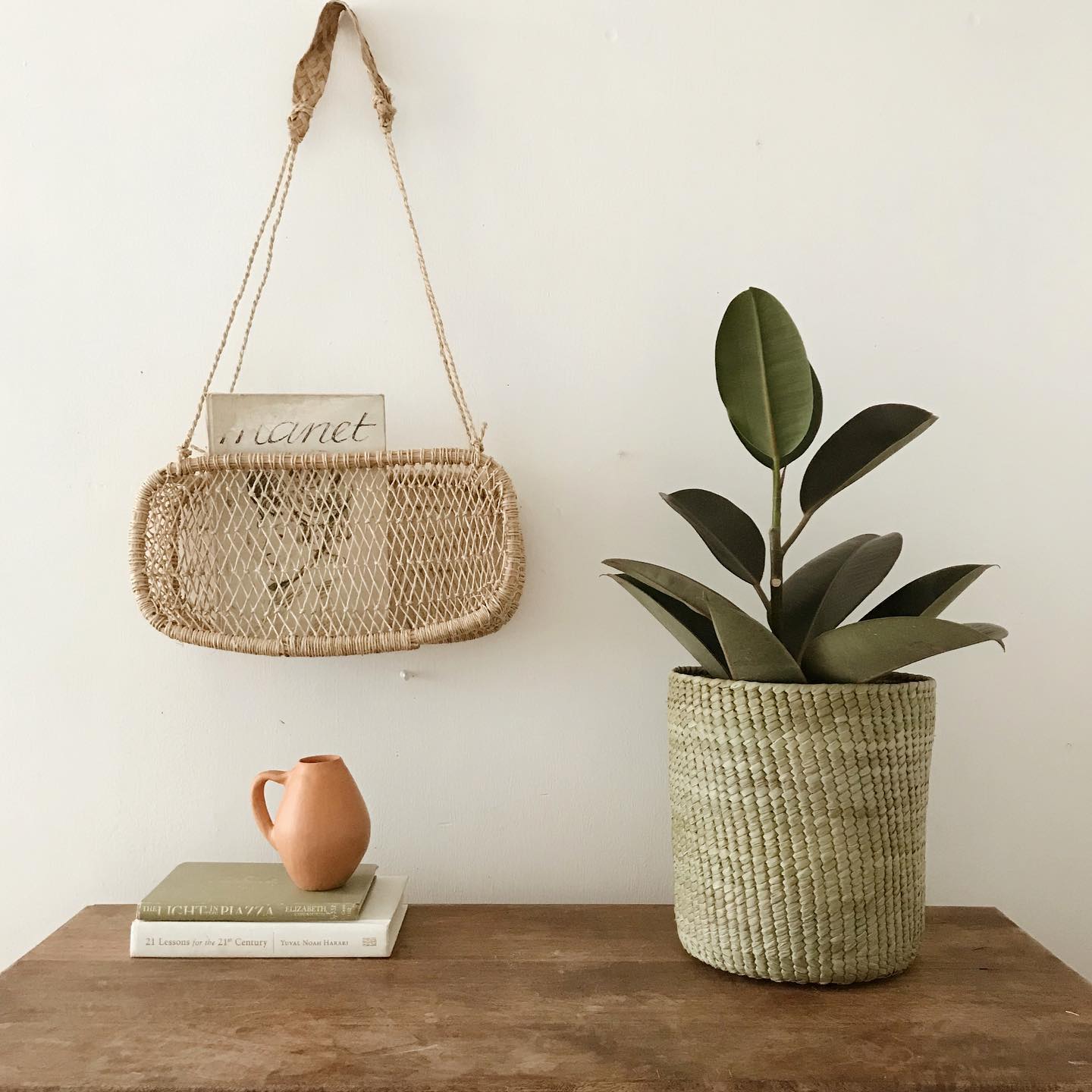 Jonote fiber basket styled in a bright room with plants and natural textures.