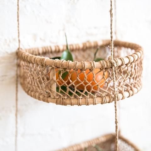 Close-up of a small woven hanging basket holding fresh fruits