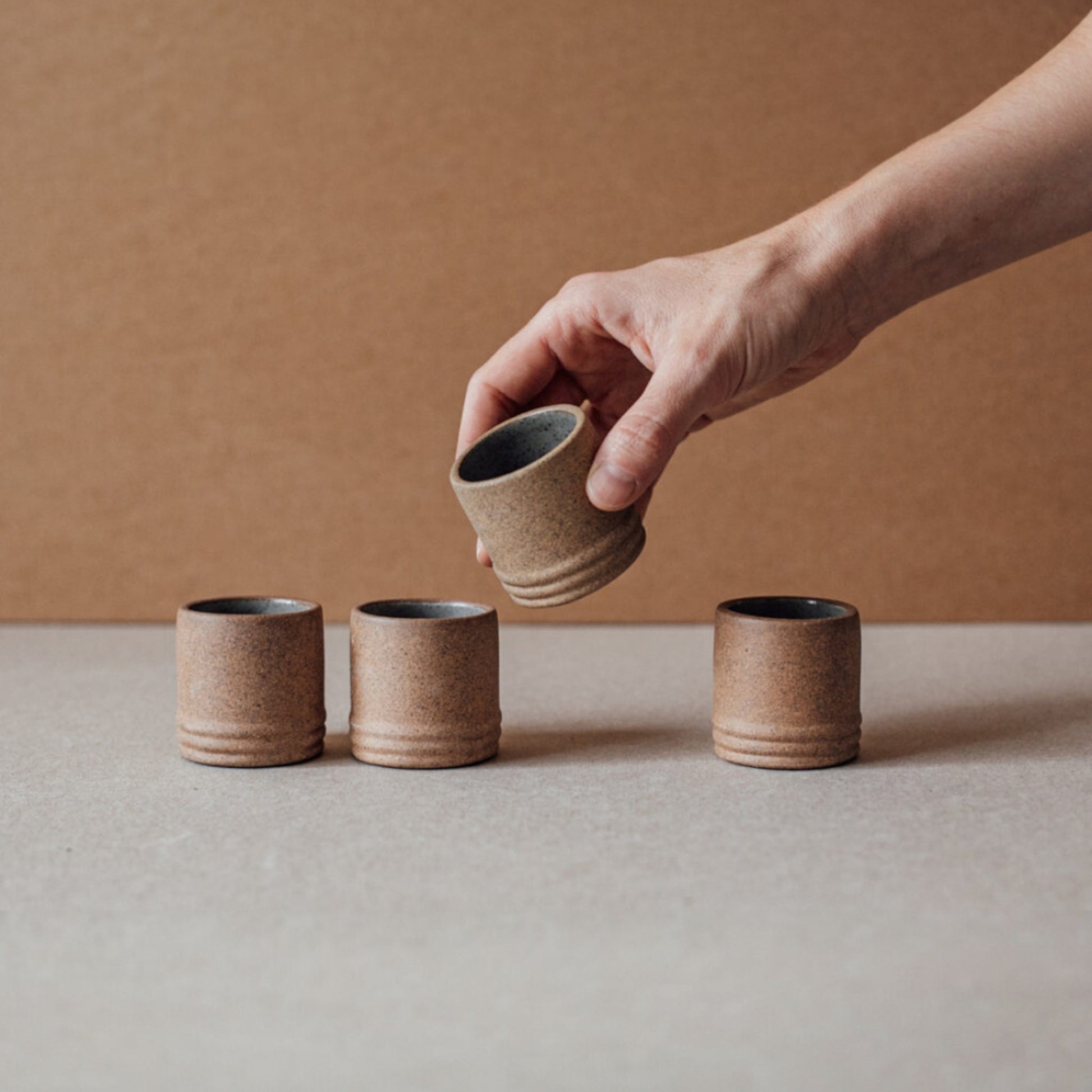 Stoneware mezcalero cups stacked to highlight interior glaze and shape