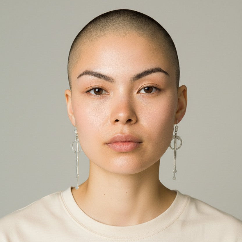 Long hammered dangle earrings with circle and bar design, handcrafted bronze base with gold or silver plating, lightweight artisan jewelry.