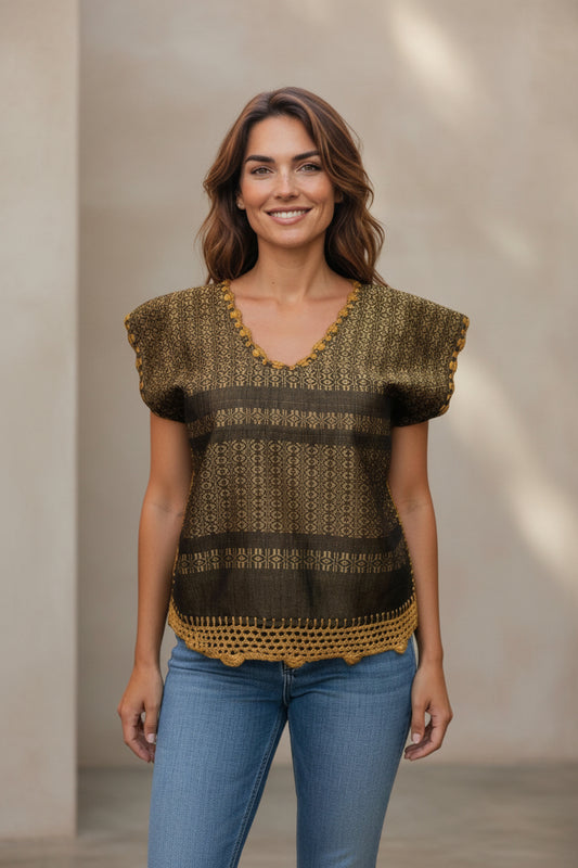 Oaxaca handwoven cotton huipil top in golden ochre worn by model, front view against neutral background